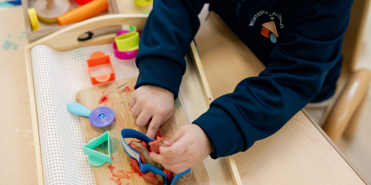 child playing in a Montessori classroom